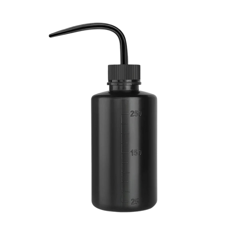 Professional water bottle with a fine nozzle for controlled rinsing during lash and brow treatments.