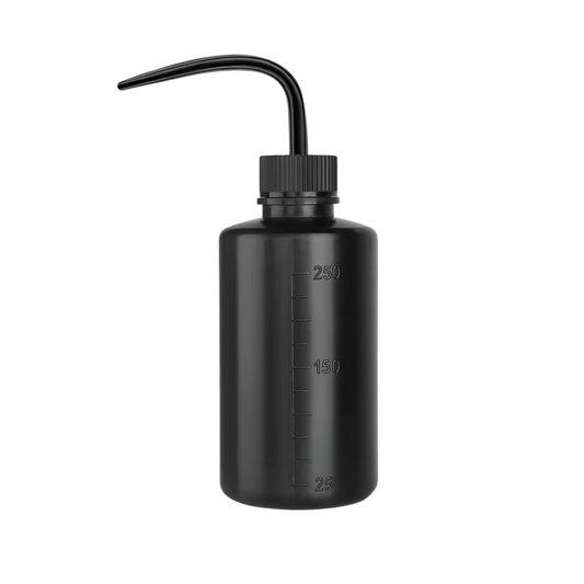 Professional water bottle with a fine nozzle for controlled rinsing during lash and brow treatments.